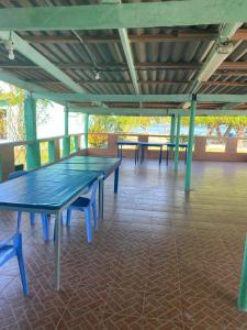 a group of ping pong tables on a deck at Hotel El Porvenir in El Porvenir