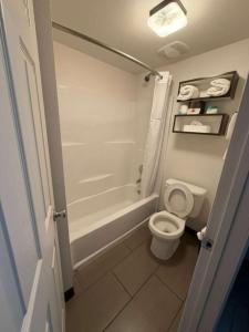 a bathroom with a toilet and a tub and a sink at Spokane Boutique Hotel in Spokane +20 photos