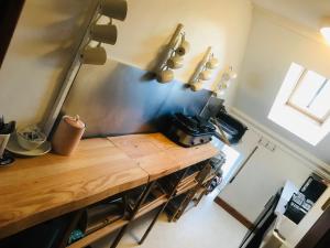 a kitchen with a wooden counter in a room at Pisgah Guesthouse Snowdonia in Blaenau-Ffestiniog