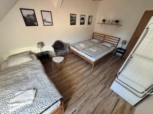 an overhead view of a bedroom with two beds at Apartmány u Klínovce in Vejprty +2 photos