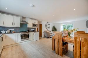 a kitchen with white cabinets and a table in a room at 2 Bed in St. Issey oc-o27778 in Saint Issey +18 photos