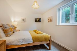 a bedroom with a bed and a window at 2 Bed in St. Issey oc-o27778 in Saint Issey