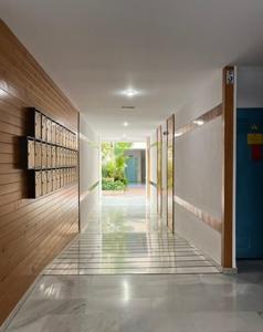 a hallway of a building with doors and a hallwayngth at Beach Side Heaven in Fuengirola