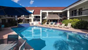 a swimming pool in front of a hotel at Days Inn by Wyndham Florida City in Florida City