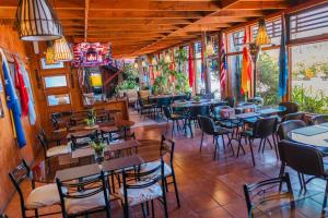 a restaurant with tables and chairs in a room at Hotel de la Costa in Talcahuano +20 photos