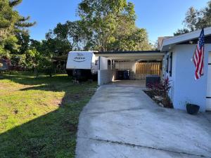 a rv is parked outside of a house at Perfect camper for your vacation in Ellenton