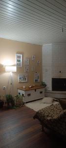 a living room with a table and a lamp at Villa Eleonas in Makri