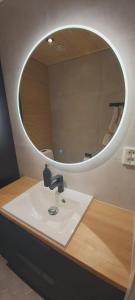 a bathroom with a sink and a mirror at Villa Juhala in Rovaniemi +29 photos