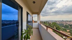 a balcony with a view of the city at Chic studio with parking & balcony in Yaoundé