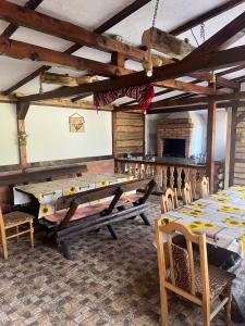 a large room with a large table and chairs at Casa Rares in Moieciu de Sus