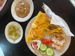 a table with two plates of food and french fries at Love beach camp in Taba +30 photos