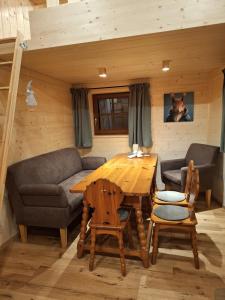 a living room with a table and a couch at Apartment Huter in Jerzens