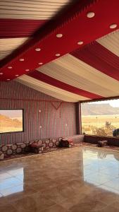 a room with a swimming pool in a building at Wadi rum sky luxury in Disah