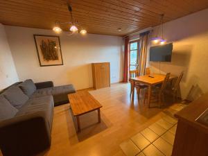 a living room with a couch and a table at Panorama Apartments II in Lohberg
