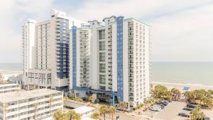 an aerial view of two tall buildings next to the beach at Bay View Resort 1202 in Myrtle Beach