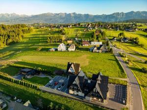 an aerial view of a village with mountains in the background at Willa Bustryk in Bustryk