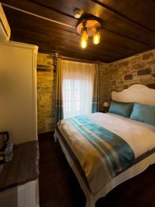 a bedroom with a large bed in a room at Marina Foça Hotel in Foça