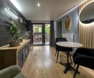 a living room with a table and a couch at La Parenthèse in Compiègne +23 photos
