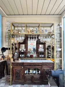 a room with a bar with a wooden shelf at Marina Foça Hotel in Foça