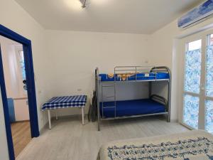 a room with two bunk beds and a window at La Rosa di Orvieto in Orvieto