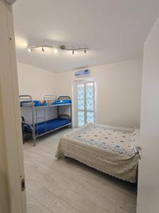 a bedroom with two bunk beds and a window at La Rosa di Orvieto in Orvieto