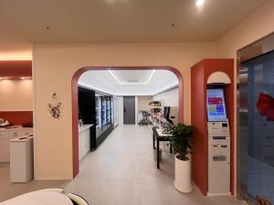 a living room with an archway leading to a kitchen at Mi Stay - StarBnB branch in Daegu