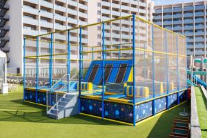 a playground in front of a building at Jupiter Albufeira Hotel - Family & Fun - All Inclusive 24h in Albufeira