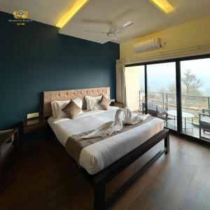 a bedroom with a large bed with a large window at Prakruthi Retreat Belagavi in Belgaum +18 photos