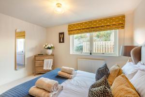 a bedroom with a bed with towels on it at 2 Bed in Norham oc-p34181 in Norham