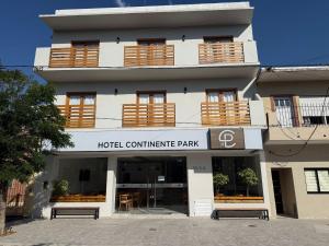 a building with benches in front of it at Continente Park in San Clemente del Tuyú