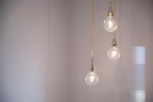 a couple of lights hanging from a wall at B&B Portorosso in Monopoli