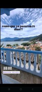a picture of a balcony with a view of the ocean at Xaveco hospedagem in Mangaratiba +4 photos