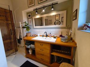 a bathroom with a sink and a mirror at La Campana in Impruneta