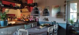 a kitchen with a table and chairs in a room at La Campana in Impruneta