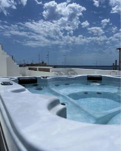 a hot tub on the roof of a building at B&B Dimora San Vincenzo in Gallipoli