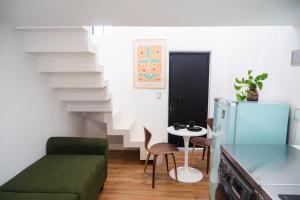 a small living room with a couch and a table at La Casona in Guadalajara