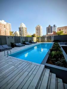 a swimming pool on the roof of a building at Studio Bliss in Neuquén