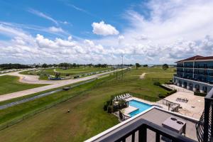 an aerial view of a resort with a pool and a building at SEVEN Sebring Raceway Hotel in Sebring