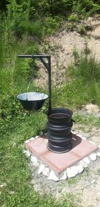 a sink and a bowl in the grass at Star Panzió in Harghita-Băi