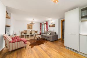 a living room with a couch and a table at Maison Carrel Elegant 1 in Breuil-Cervinia