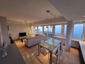 a living room with a couch and a table at Faro in Blankenberge