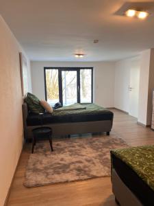 a room with a bed and a window in it at Villa Belmonte in Weilheim an der Teck
