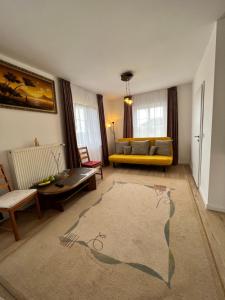 a living room with a couch and a table at Aparts4ring 10, Nürburg in Nürburg