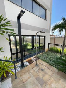 a house with a walkway in front of it at Fully equipped apt: A/C, pool & gym in Downtown in Taubaté
