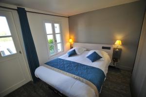 Säng eller sängar i ett rum på Le Cap Hornu
