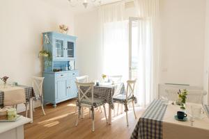 a kitchen and dining room with a table and chairs at Dolce Conero Guest House in Camerano +36 photos
