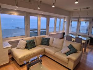 a living room with a couch and a table at Faro in Blankenberge