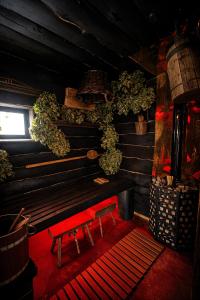 a red bench in a room with a window at Netri SPA in Zofʼyuvka