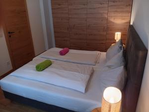 two pillows on a bed in a room at Top 103 Lärchenhof in Mauterndorf +10 photos