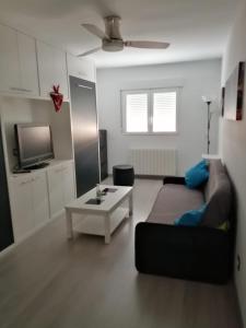 a living room with a couch and a coffee table at Como en tu casa in Zaragoza